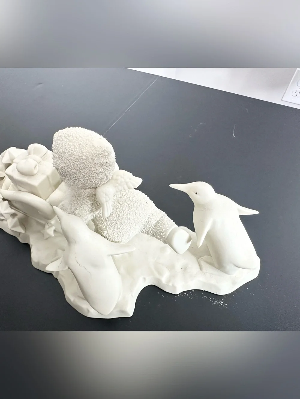 Department 56 Cream Ceramic Angel child on Sled Figurine